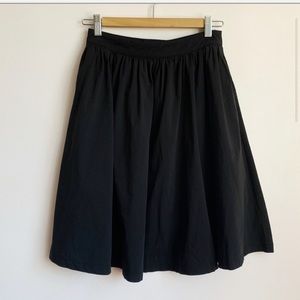 high waist black circle skirt (above the knee)